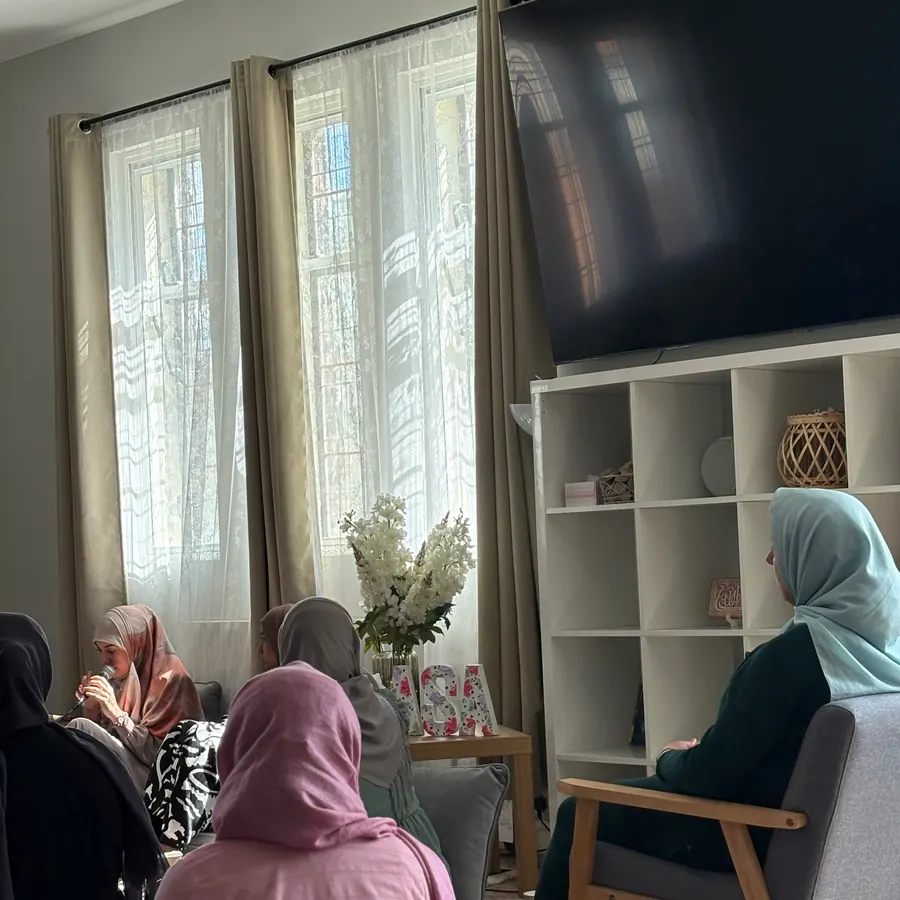 Sisters listening together by the window